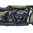 Motorcycle engine with black exhaust pipes showcasing Kuryakyn precision tappet block accent