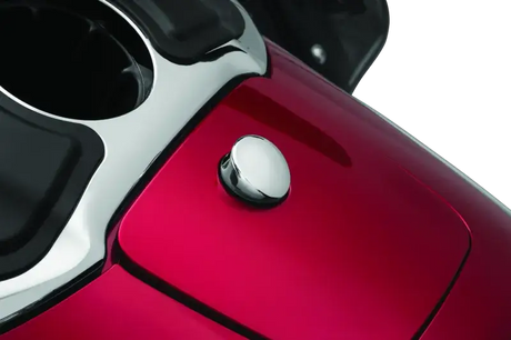 Chrome Kuryakyn Quick Release Fuel Door Knob on a red motorcycle