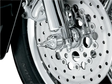 Chrome motorcycle front wheel with Kuryakyn Roman Axle Caps for style and protection