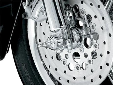 Chrome motorcycle front wheel with Kuryakyn Roman Axle Caps for style and protection