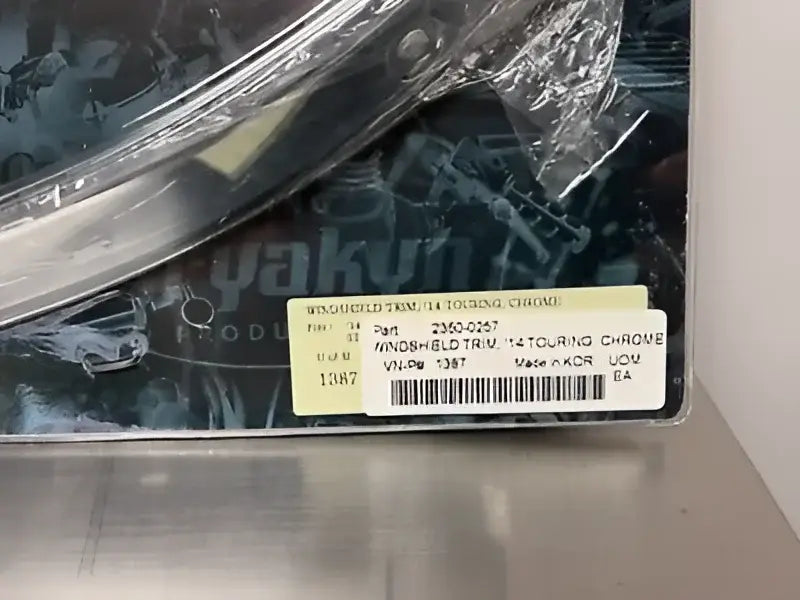 Windshield trim in packaging for Kuryakyn Smooth Windshield Trim 14-Up Touring Chrome
