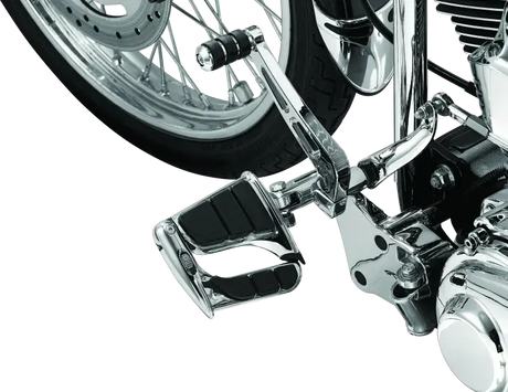 Kuryakyn Swingwing Peg with Male Mount Adapter in chrome finish, installed on a motorcycle, showcasing adjustable foot positioning and durable construction.