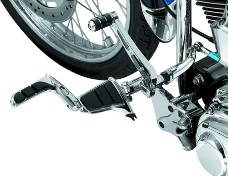 Kuryakyn Swingwing Peg with Male Mount Adapter in chrome installed on a motorcycle.