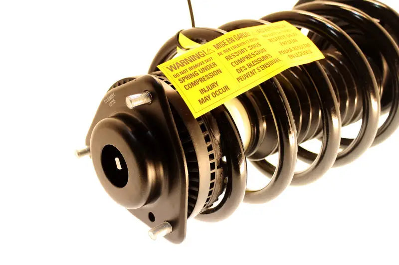 Black coil spring strut assembly for Chrysler Town & Country Dodge Grand Caravan KYB shocks