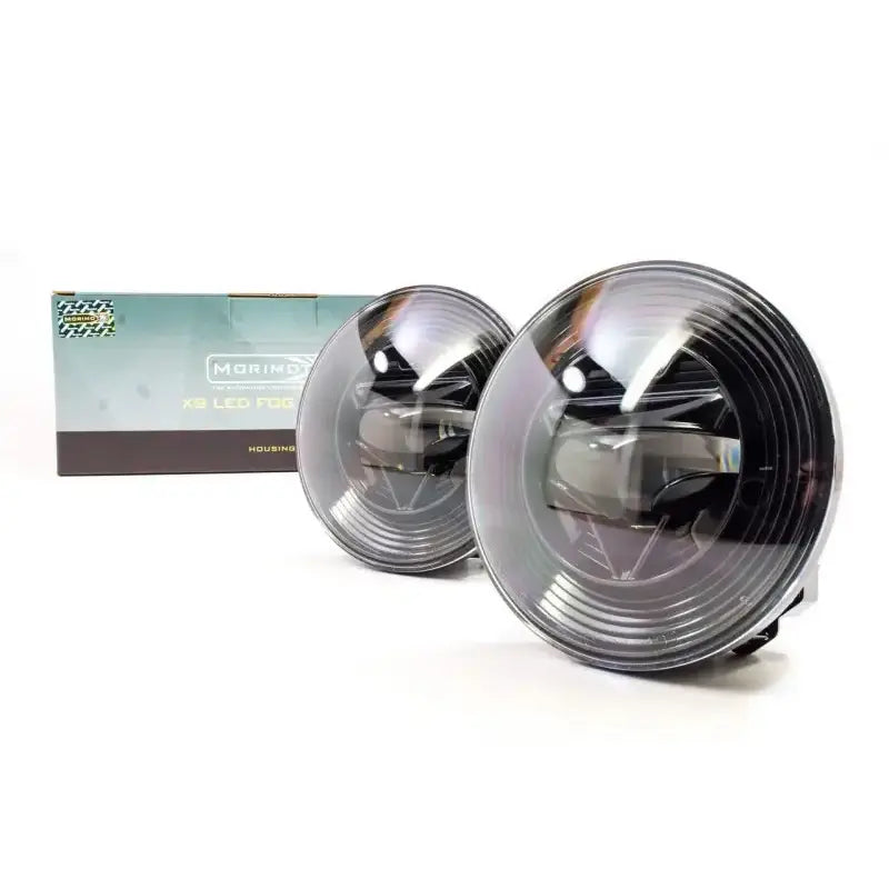 LF111 Morimoto Xb LED Fogs Type GM Pair with box packaging showcasing advanced Morimoto Xb LED technology for enhanced vehicle fog light performance and aesthetic.