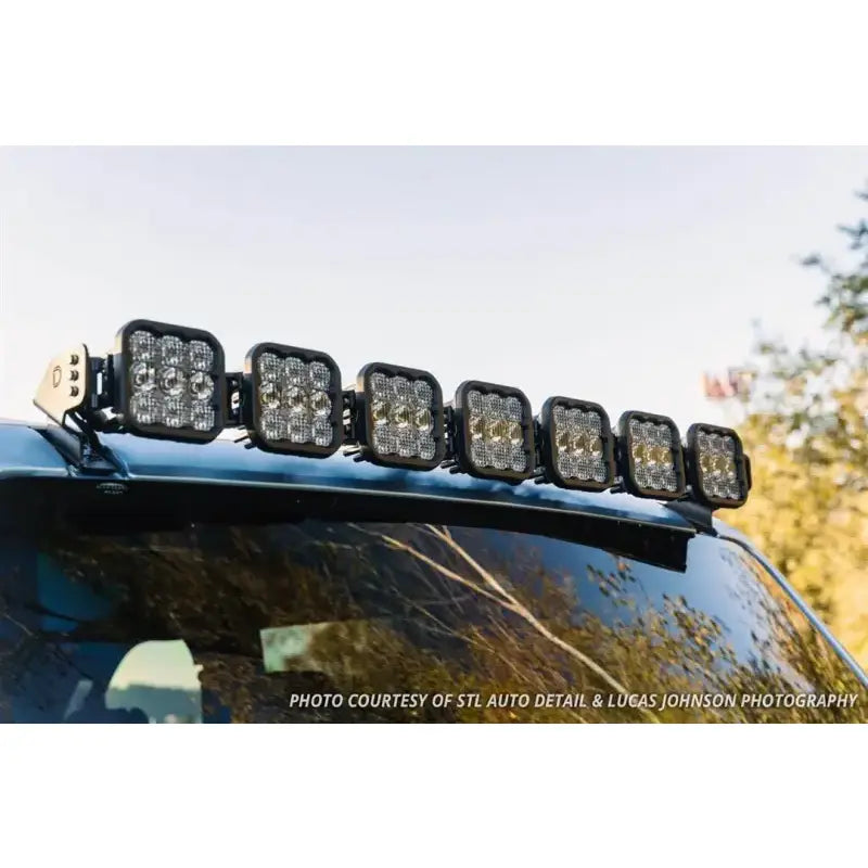 Roof-mounted LED light bar for trucks with driving and flood combo beams and black housing