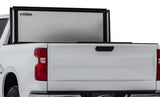 White pickup truck with lomax stance hard textured silver tonneau cover on Ford F-150