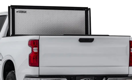 White pickup truck with lomax stance hard textured silver tonneau cover on Ford F-150