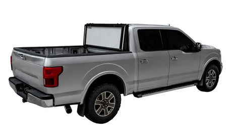 Silver pickup truck with bed rack showing Ford Ranger with Lomax Stance Hard Cover