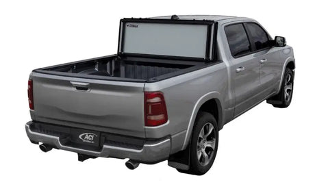 Silver pickup truck with Lomax Stance Hard Cover on 19+ Ram 2500/3500 bed