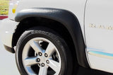 White Ram truck front quarter with Lund ex-extrawide style textured black fender flares