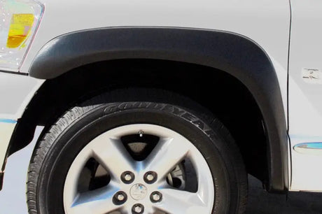 Car wheel and fender with Lund ex-extrawide style fender flares for Dodge Ram 1500