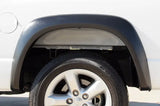 Truck wheel well with tire featuring Lund ex-extrawide style fender flares for Dodge Ram