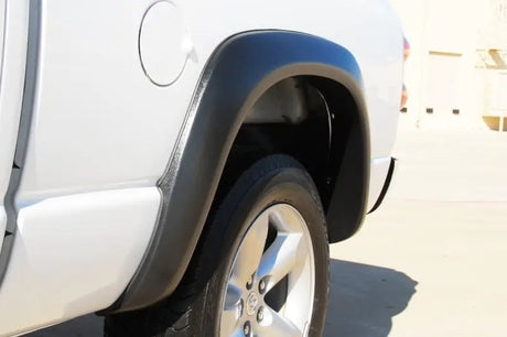 White truck rear quarter panel with Lund ex-extrawide style fender flares for Dodge Ram