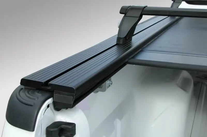 Black and silver Pace Edwards Jackrabbit Rail with ladder for Toyota Tacoma roof rack