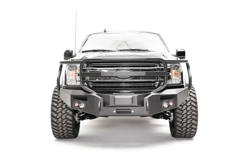 Black truck with heavy-duty grill guard from M3852-1 Fab Fours Ford Rap Adapt Rel Bracket