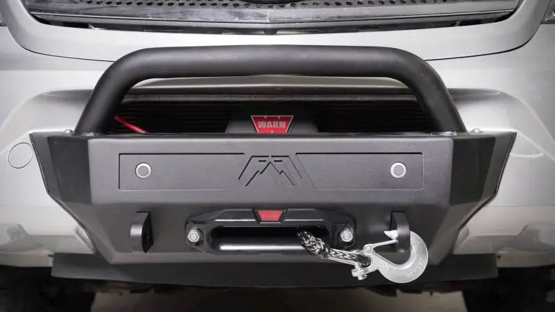 Black off-road bumper with winch and Fab Fours sensor plate for added protection