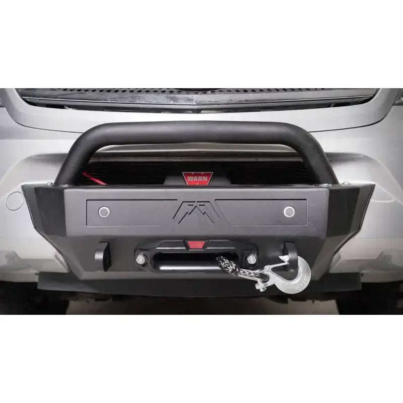 Black off-road bumper with winch and Fab Fours sensor plate for added protection