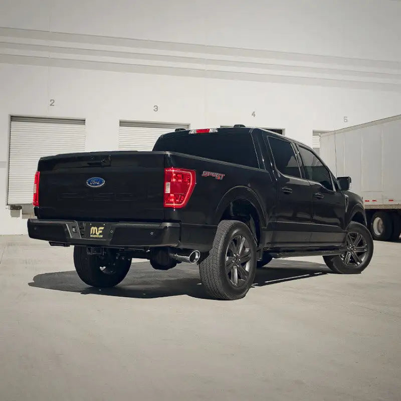 Black Ford F-150 pickup truck with MagnaFlow Sys for routes in Chrysler Crossfire driving experience