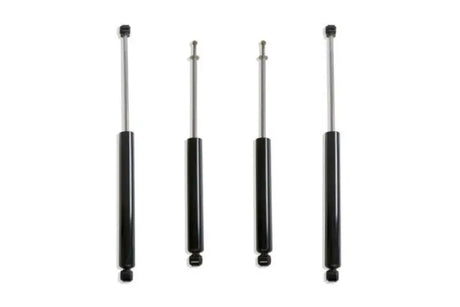 Four black and silver shocks for Ford F-250 F-350 4WD maxtrac shocks 943380S