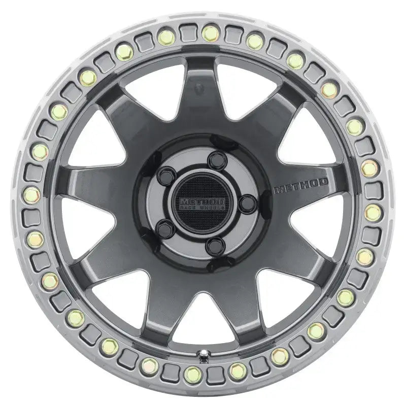 Method MR108 17x9 -44mm Offset 5x5 71.5mm CB Gloss Titanium wheel with BH-H24125-38, stylish race-inspired design.