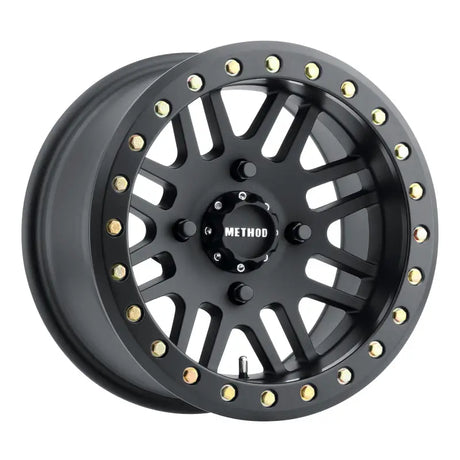 Black off-road Method MR406 UTV beadlock wheel with gold bolts for rugged style