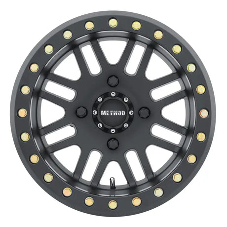 Black off-road Method MR406 UTV Beadlock wheel with gold bolts for tough trails