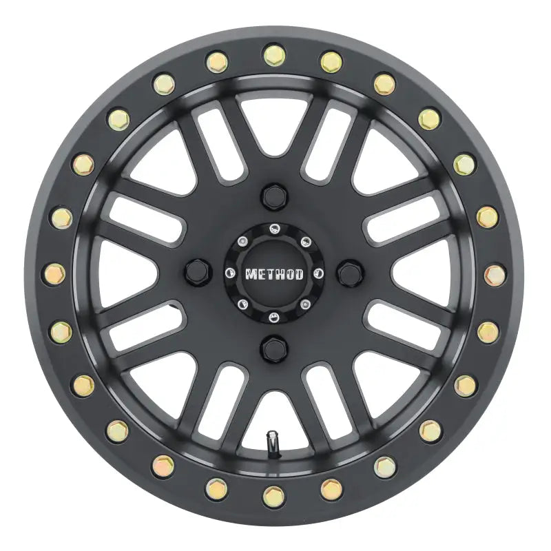 Black off-road Method MR406 UTV beadlock wheel with gold bolts for rugged off-road looks