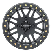 Black off-road Method MR406 UTV beadlock wheel with gold bolts for rugged off-road looks