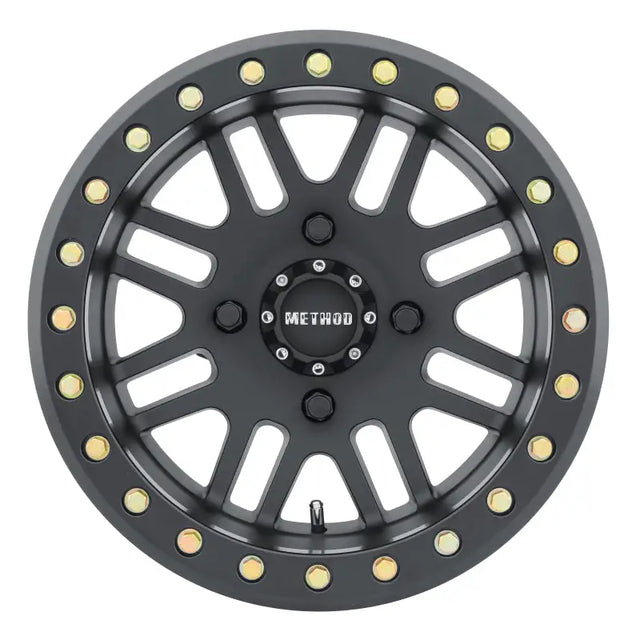 Black off-road Method MR406 UTV beadlock wheel with gold bolts for rugged off-road looks