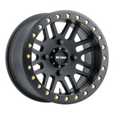 Black off-road Method MR406 UTV wheel with gold bolts, perfect for beadlock setups