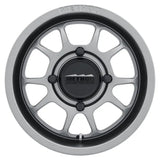 Silver and black Method MR409 bead grip wheel for off-road trucks