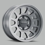 Silver gloss titanium Method MR703 15x7 wheel with multi-spoke design and black center cap