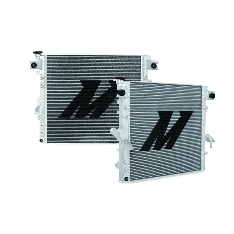 Two silver Mishimoto radiators with black logos for Jeep Wrangler JK Performance V2