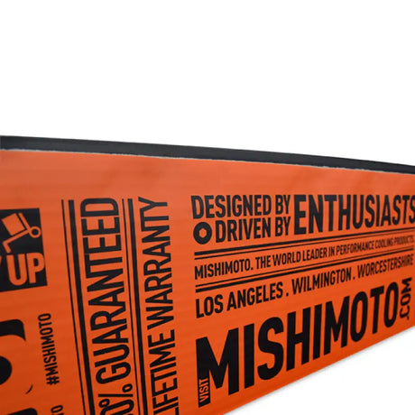 Mishimoto Aluminum Radiator Packaging with bold typography displaying guarantees and product information.