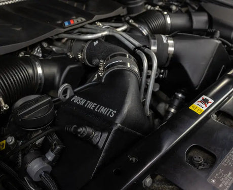 Black BMW F10 engine component from Mishimoto 12-16 F10 M5 intercooler kit
