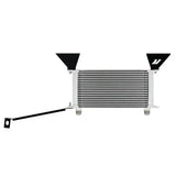 White and silver intercooler with black brackets from Mishimoto oil cooler kit for Ford Mustang