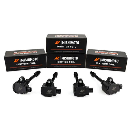 Four black Honda Civic ignition coils with boxes for Mishimoto 16-21 single ignition coil