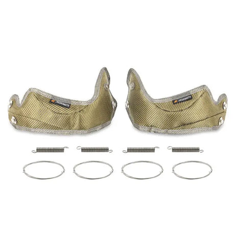 Gold-colored exhaust heat shields with springs for Mishimoto turbo blanket on Ford Raptor