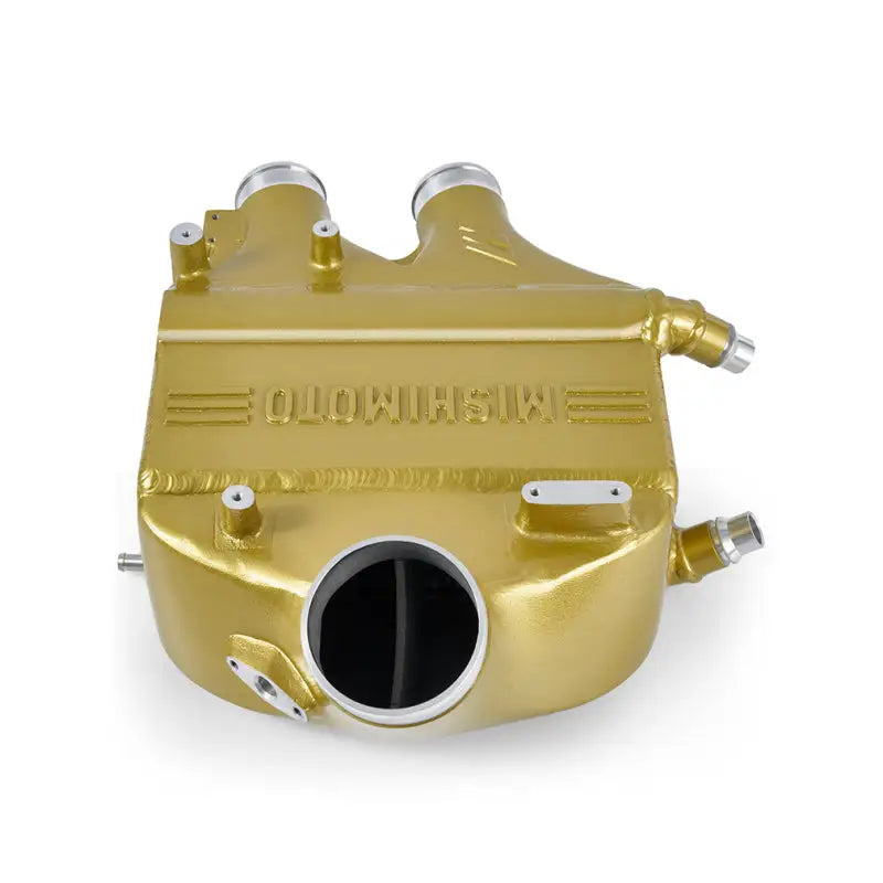 Gold-colored BMW F80 intercooler with dual inlets for improved core volume and heat transfer