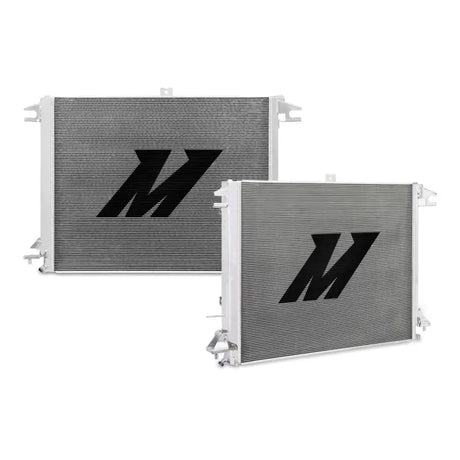 Two silver aluminum radiators with black logos for Nissan Titan cooling efficiency