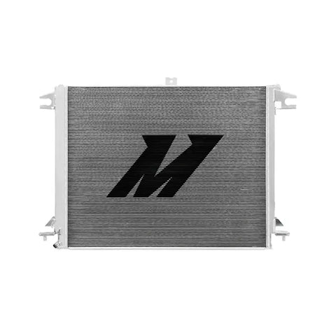 Silver Nissan Titan aluminum radiator with black logo boosting cooling efficiency