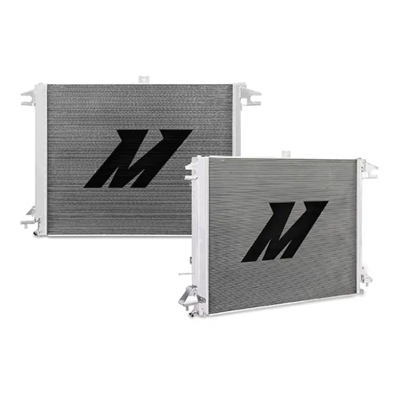 Two silver Nissan Titan aluminum radiators with black logos for cooling efficiency