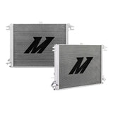 Two silver Nissan Titan aluminum radiators with black logos for cooling efficiency