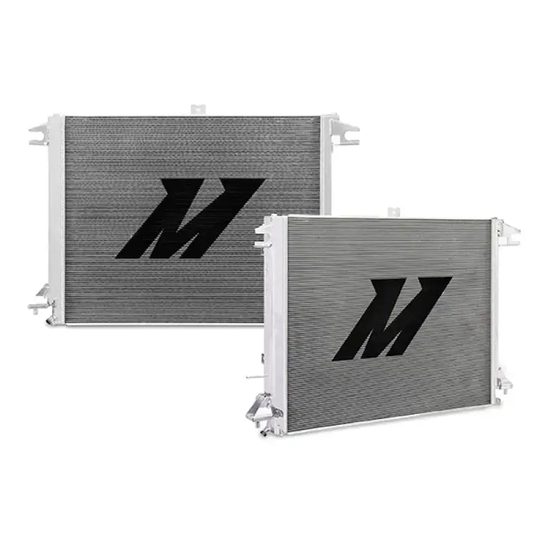 Two silver Nissan Titan aluminum radiators with black logos for cooling efficiency
