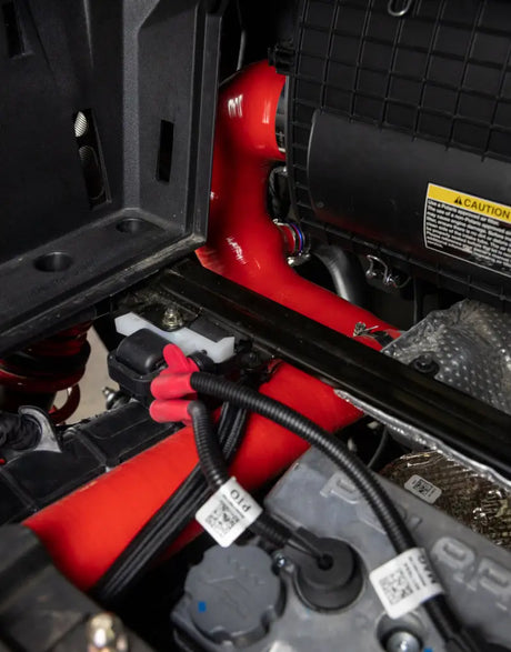 Red engine hose on Mishimoto silicone intake j-tube for Polaris RZR XP Turbo