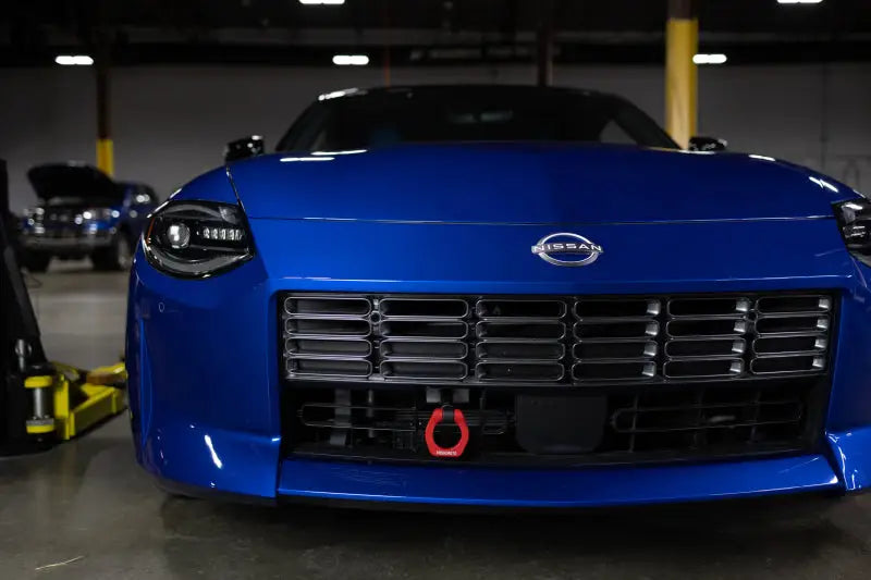 Blue Nissan Z sports car with Mishimoto 2023+ Nissan Z Tow Hook front, great RV parts & accessories