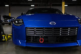 Blue Nissan Z sports car with Mishimoto 2023+ Nissan Z Tow Hook front, great RV parts & accessories