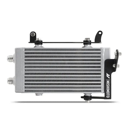 Silver automotive oil cooler with black brackets from Mishimoto 2023+ Toyota GR Corolla oil cooler kit