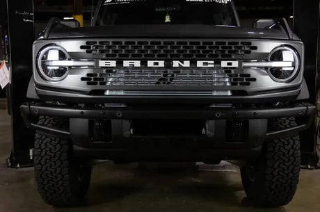 Front view of a dark gray Ford Bronco with Mishimoto 21+ Bronco high mount INT kit core p pipes